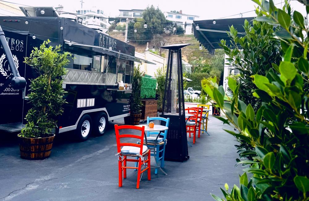 Petros Kafe outside with food truck and trees