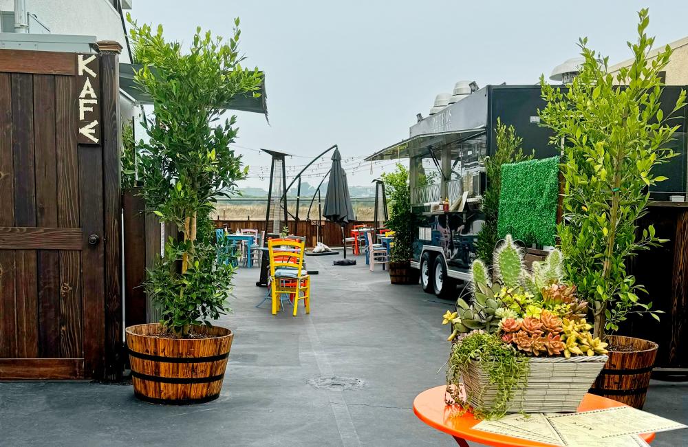 Petros Kafe with trees and orange table