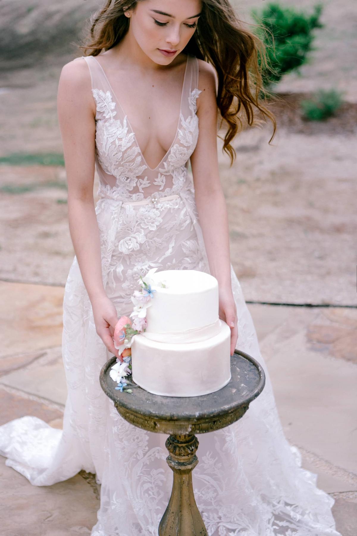 Bride with Cake on Table for Mika & James's Wedding
