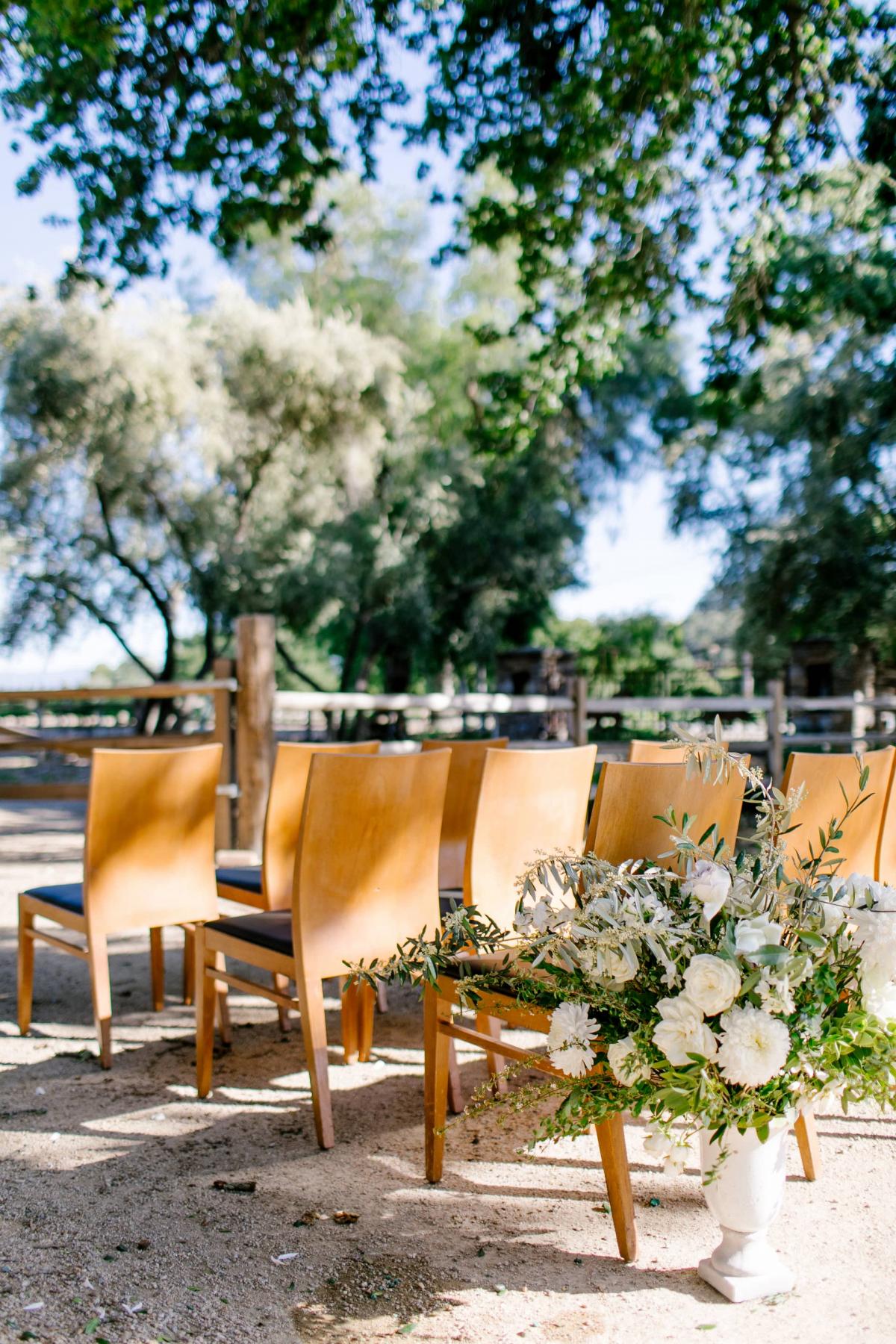 Outdoor Reception Area with Chairs, Flower Arrangements for Danielle & Jake's Wedding