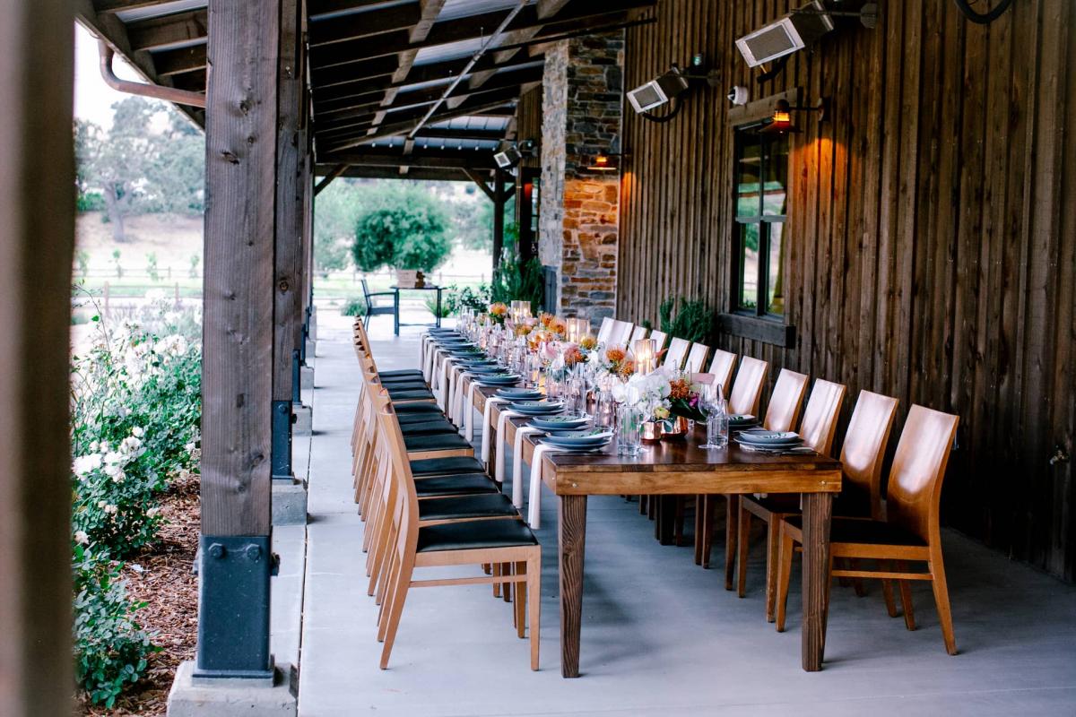 End View of Long Reception Table on Veranda Behind Hills for Mika & James's Wedding