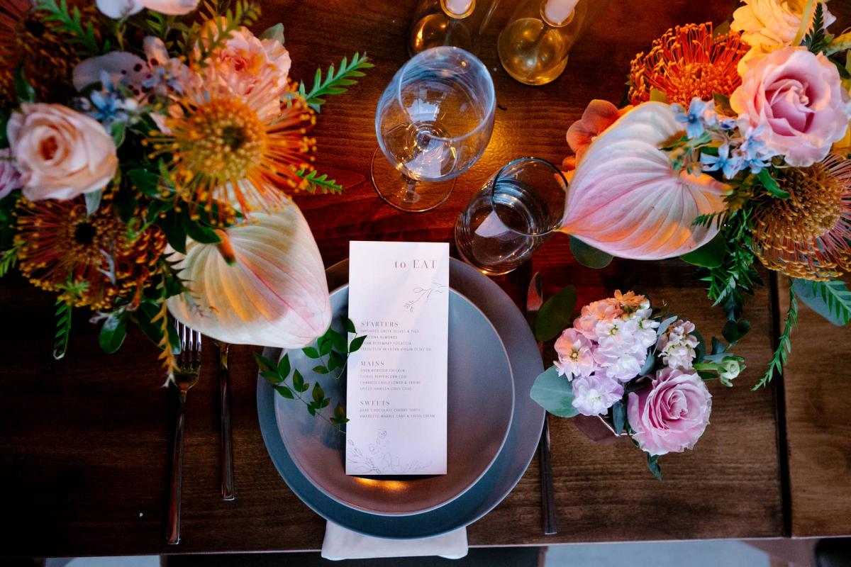 Overhead of Menu, Placemat & Flowers for Mika & James's Wedding