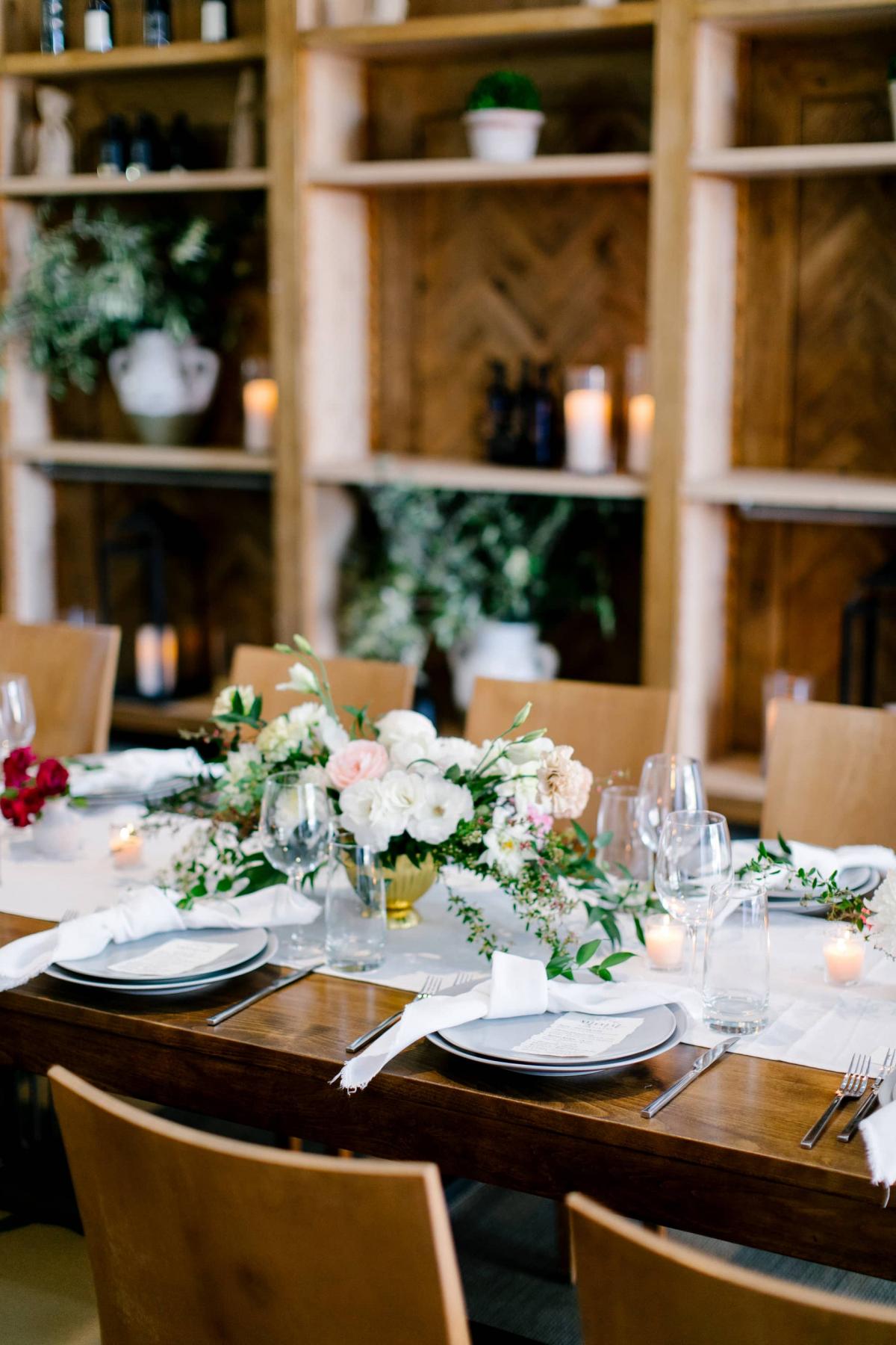 Reception Table & Chairs with Wooden Bookcases Behind for Danielle & Jake's Wedding