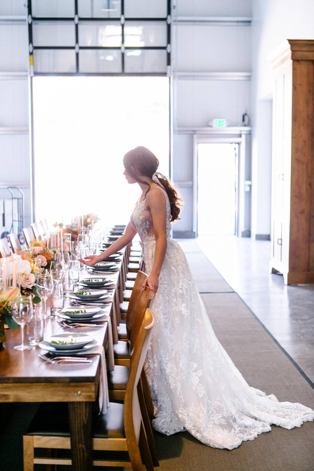 Long Reception Table with Bride Leaning Over for Mika & James's Wedding