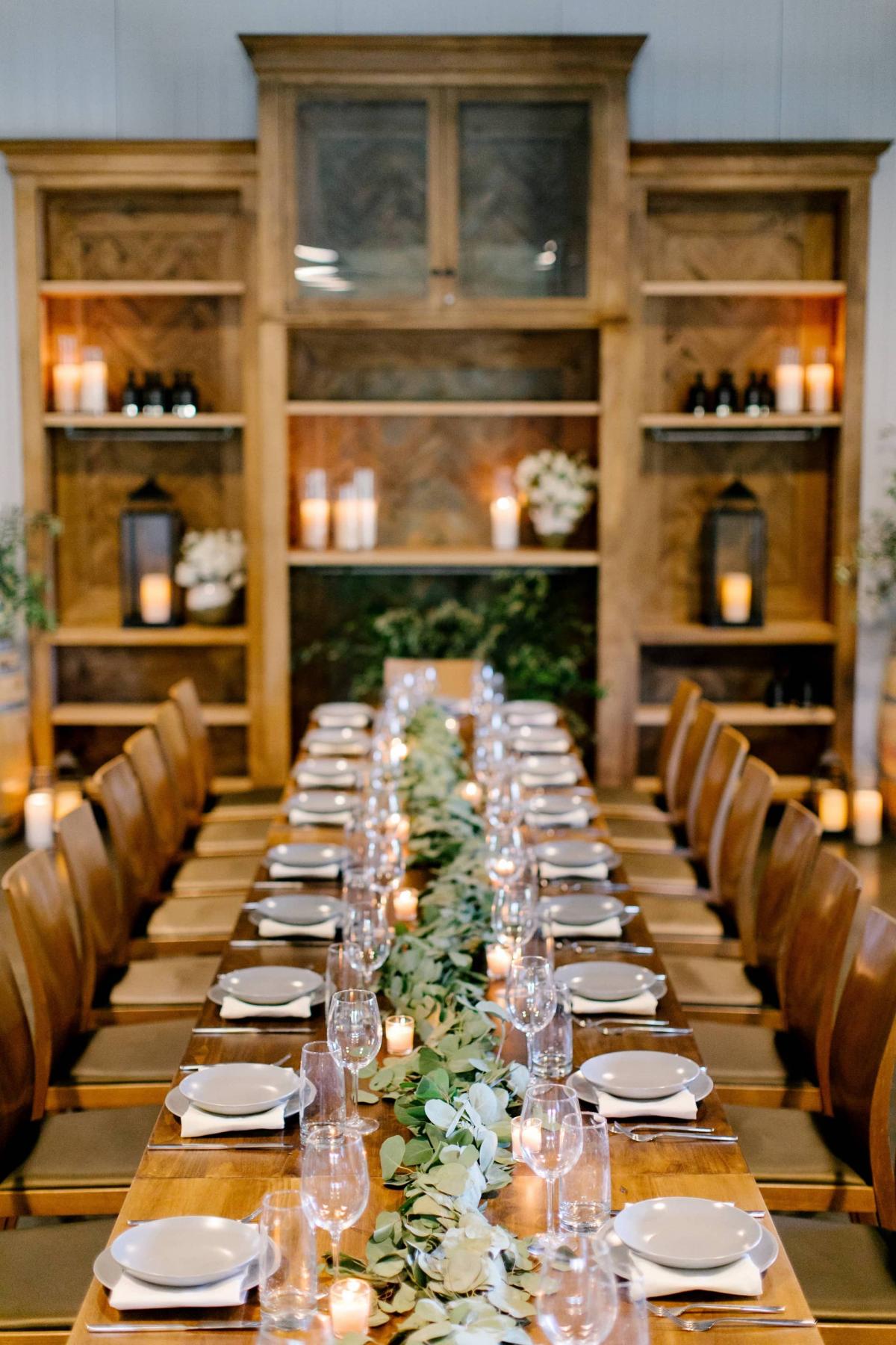 Straight Long View of Long Reception Table, Chairs and Candles at Petros Winery