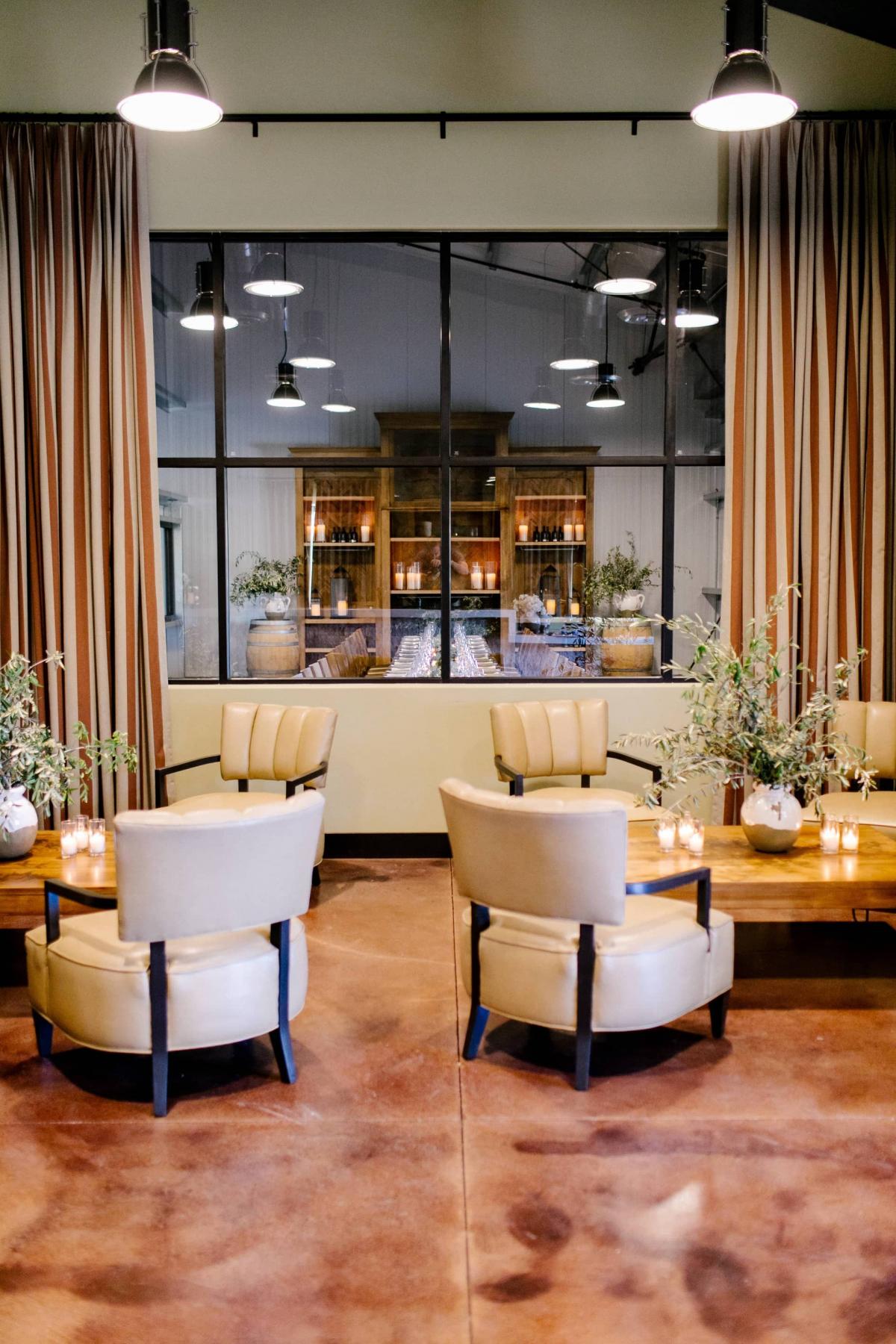 Petros Winery Reception Area Looking Through Glass to Long Reception Table with Bookcase Behind