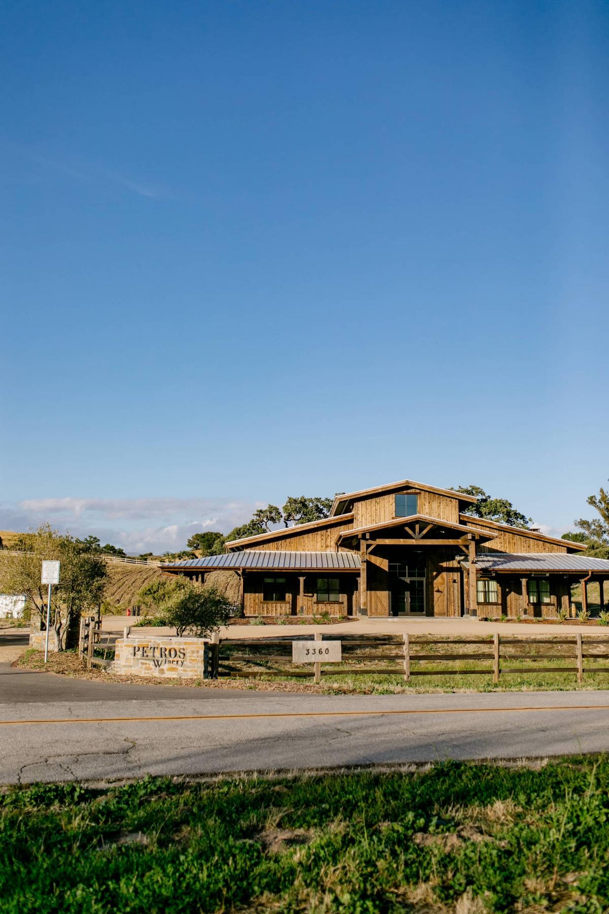 Wide Shot of Petros Winery Ranch from the Main Road with Grass
