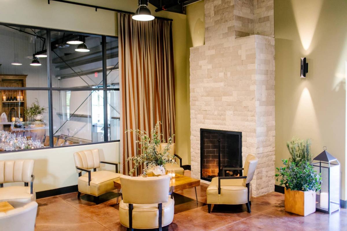 Petros Winery Reception Area with Chairs, Planters, Glass Candle Holder, Fireplace with Lampshades