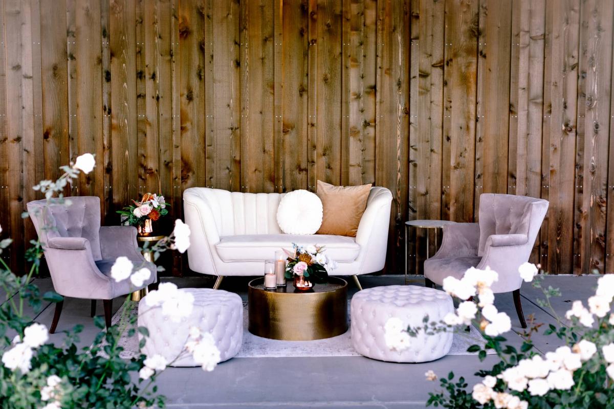 Outdoor Setting with Couch, 2 Chairs, Coffee Table and Poofs for Mika & James's Wedding