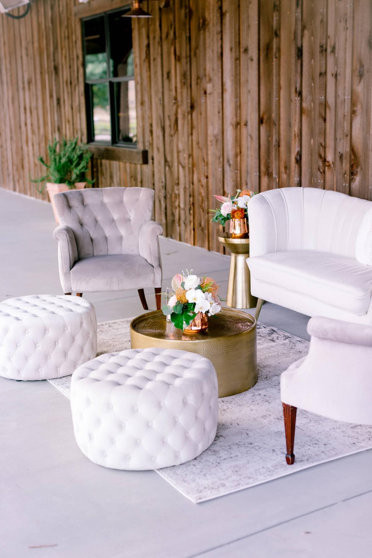 Side Angle of Outdoor Setting with Couch, 2 Chairs, Coffee Table and Poofs for Mika & James's Wedding